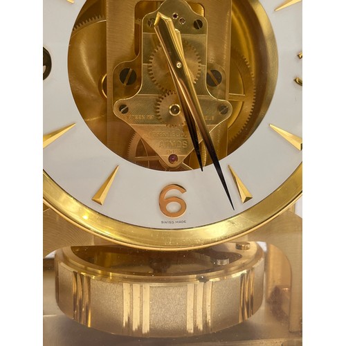 6025 - A Jaeger-LeCoultre Atmos clock, gilt and lacquered brass case, no. 540348, 30cm high approx.