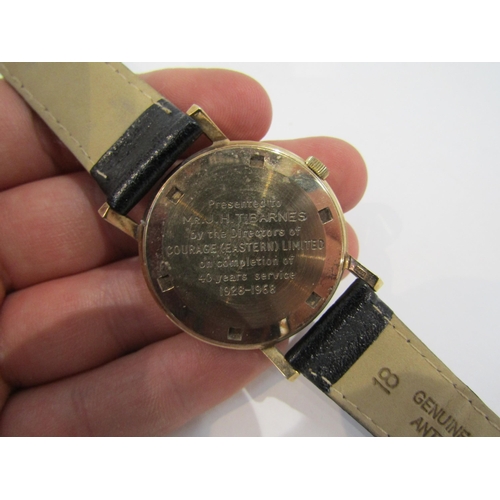 6008 - A gentleman's Vertex Revue wristwatch, with pearlised face, the back engraved with a presentation in... 