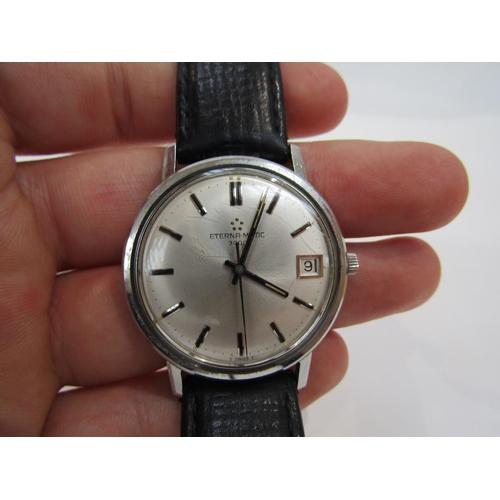 6011 - An Eterna-Matic stainless steel cased automatic wristwatch, silver dial with centre seconds and date... 