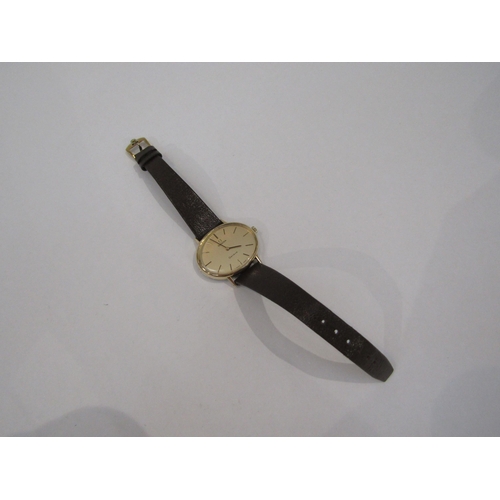 6012 - An Omega Geneve gold plated and steel cased manual wind wristwatch of oval form, gilded dial and Ome... 