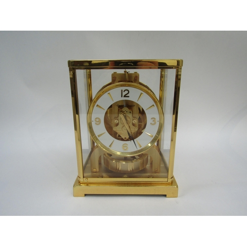 6025 - A Jaeger-LeCoultre Atmos clock, gilt and lacquered brass case, no. 540348, 30cm high approx.