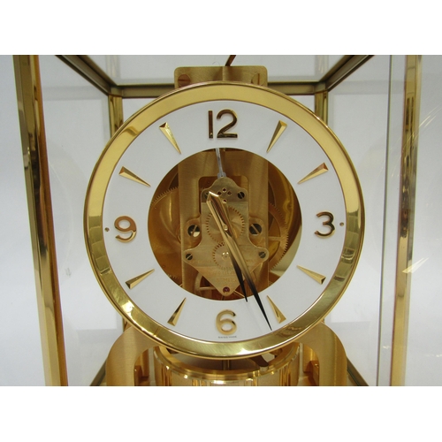 6025 - A Jaeger-LeCoultre Atmos clock, gilt and lacquered brass case, no. 540348, 30cm high approx.