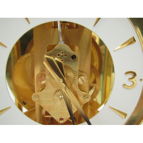 6025 - A Jaeger-LeCoultre Atmos clock, gilt and lacquered brass case, no. 540348, 30cm high approx.