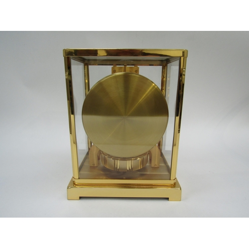 6025 - A Jaeger-LeCoultre Atmos clock, gilt and lacquered brass case, no. 540348, 30cm high approx.