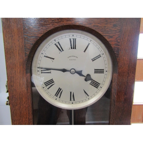 6040 - A 20th Century oak cased Synchromonic electric master clock with pendulum