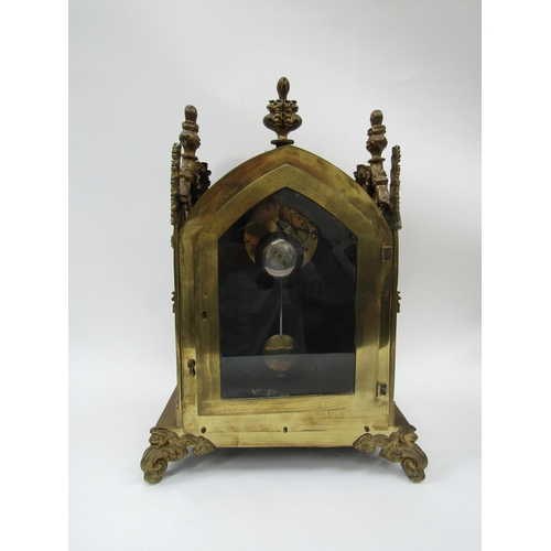 6042 - A 19th Century brass cased bracket clock of architectural design, painted metal convex Roman dial wi... 