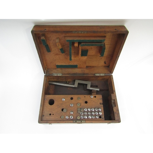 6051 - An 8mm watchmaker's lathe for restoration, with a box of various collects and runners, together with... 