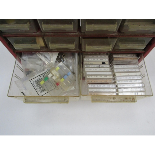 6055 - A large collection of watch/clock fixings and spares in various multi drawer cabinets including scre... 