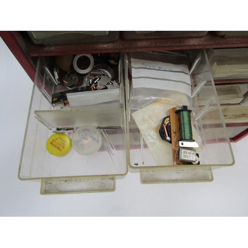 6055 - A large collection of watch/clock fixings and spares in various multi drawer cabinets including scre... 