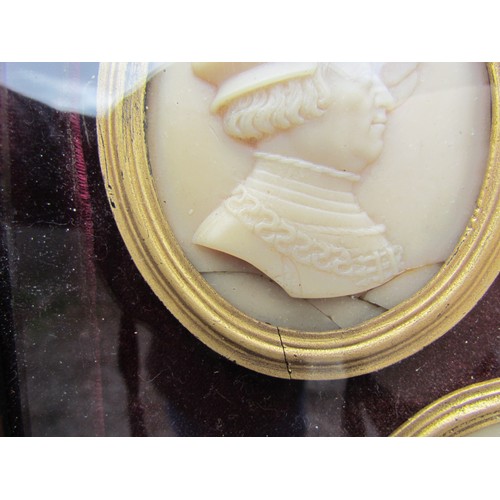 9044 - A late 19th Century group of seven wax relief oval portraits of Tudor Dignitaries set on a plum velv... 