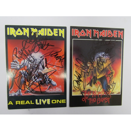 8243 - IRON MAIDEN: A collection of assorted memorabilia including two signed postcards, aftershow and gues... 