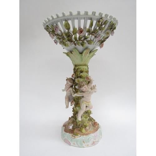9021 - A mid to late 19th Century German porcelain table centrepiece basket with three frolicking cherubs, ... 