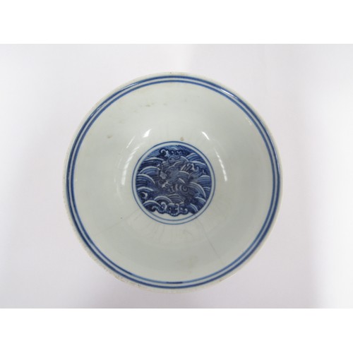 9032 - A Chinese blue and white stem cup with winged dragon and waves, six character marks within base, hai... 