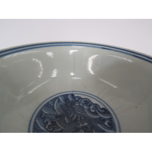 9032 - A Chinese blue and white stem cup with winged dragon and waves, six character marks within base, hai... 
