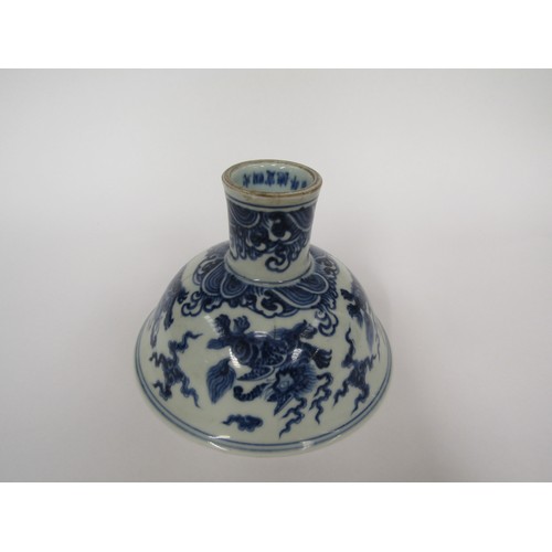 9032 - A Chinese blue and white stem cup with winged dragon and waves, six character marks within base, hai... 