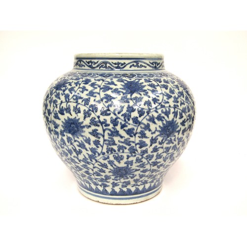 9031 - A Chinese blue and white bulbous form jardinière with scrolling lotus flower decoration, unmarked, 3... 