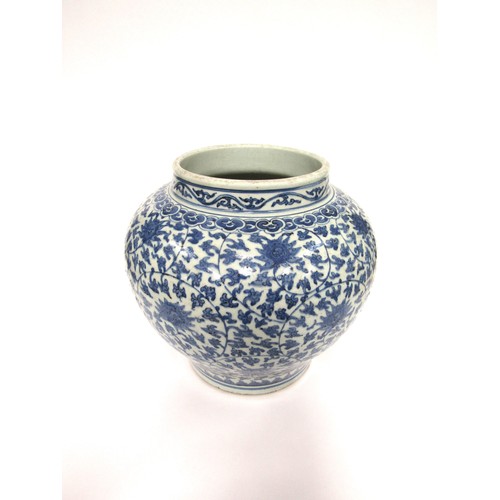 9031 - A Chinese blue and white bulbous form jardinière with scrolling lotus flower decoration, unmarked, 3... 