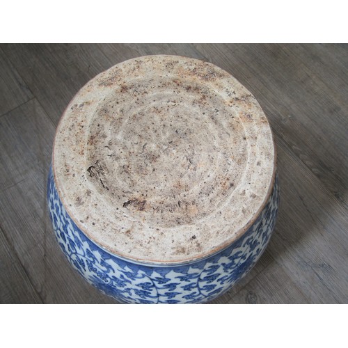 9031 - A Chinese blue and white bulbous form jardinière with scrolling lotus flower decoration, unmarked, 3... 