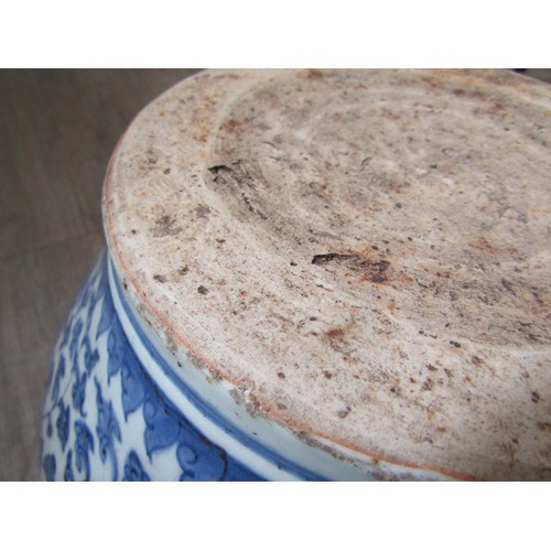 9031 - A Chinese blue and white bulbous form jardinière with scrolling lotus flower decoration, unmarked, 3... 
