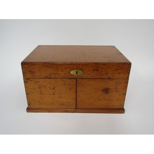 9056 - An early 20th Century oak cased games compendium with boxwood and ebony chess pieces (king 2.5” high... 