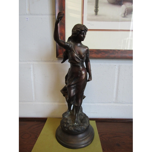 1012 - A spelter figure of a female on circular base, 47cm high