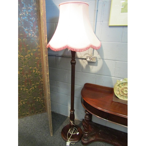 1032 - A mahogany standard lamp with pink shade     (E) £8-12 Blyth Barn