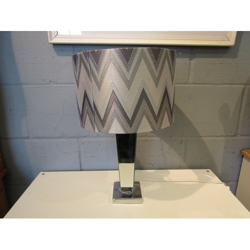 1034 - A mirrored glass table lamp with zig zag design shade