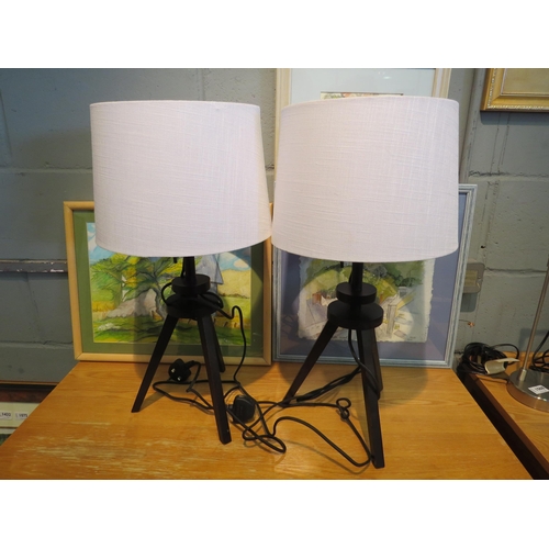 1061 - A pair of black tripod lamp bases with white shades     (R) £15