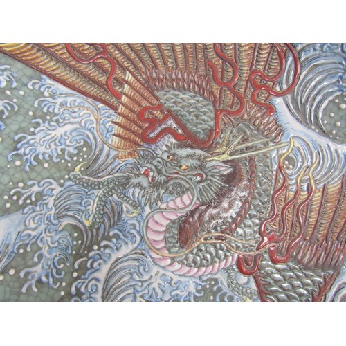 9009 - An early 20th Century Japanese crackle glaze charger with three toed dragon, 49cm diameter