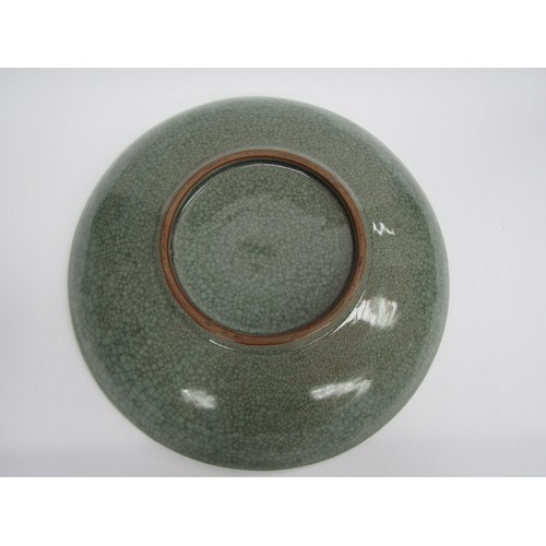9009 - An early 20th Century Japanese crackle glaze charger with three toed dragon, 49cm diameter