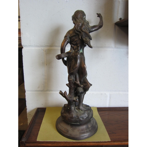 1012 - A spelter figure of a female on circular base, 47cm high