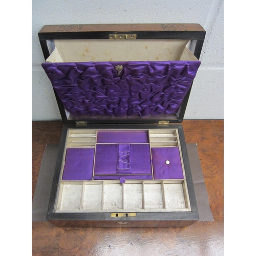 1027 - A marquetry inlaid jewellery box with mother-of-pearl cartouche and escutcheon