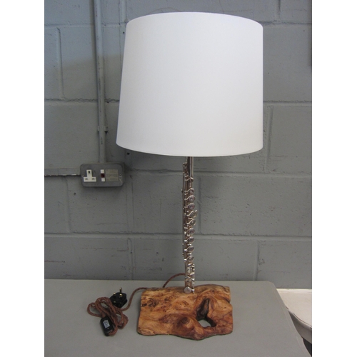 1048 - A table lamp, the column of flute instrument form on yew wood base, white shade, 75cm high including... 