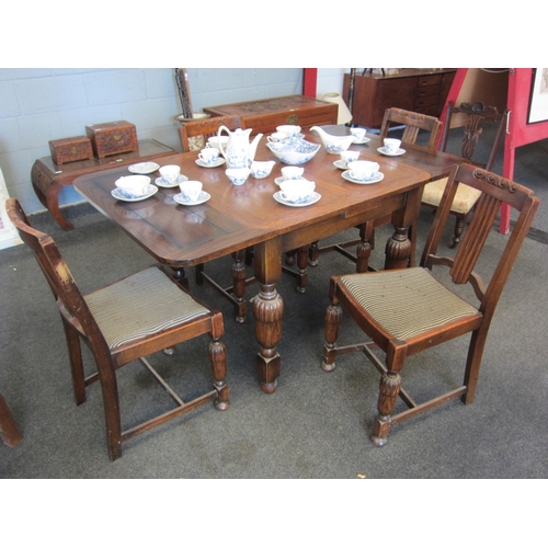 1083 - An oak draw-leaf table with a set of four chairs     (E) 10-20