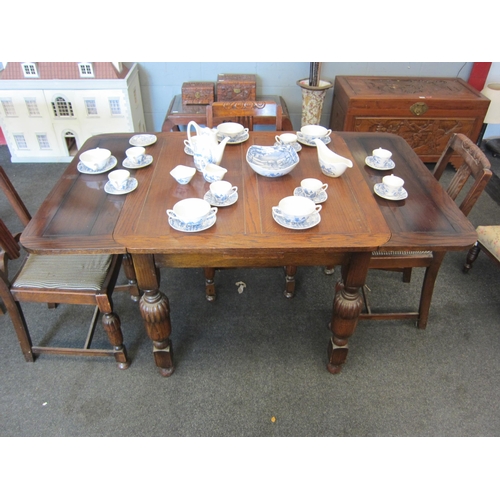 1083 - An oak draw-leaf table with a set of four chairs     (E) 10-20