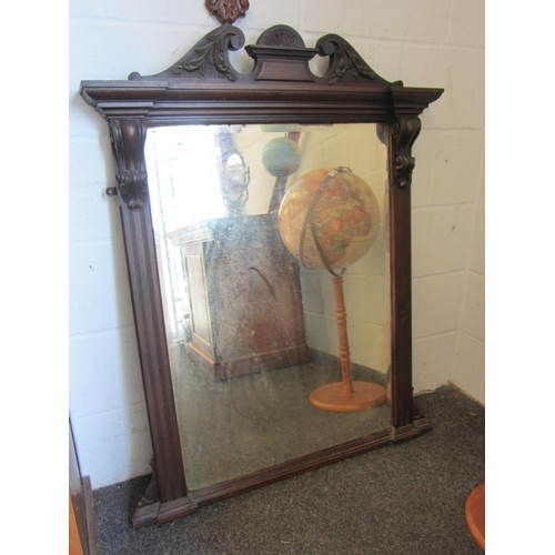 1008 - An Edwardian mahogany overmantel mirror with broken arch swan neck pediment, reeded column frame, be... 