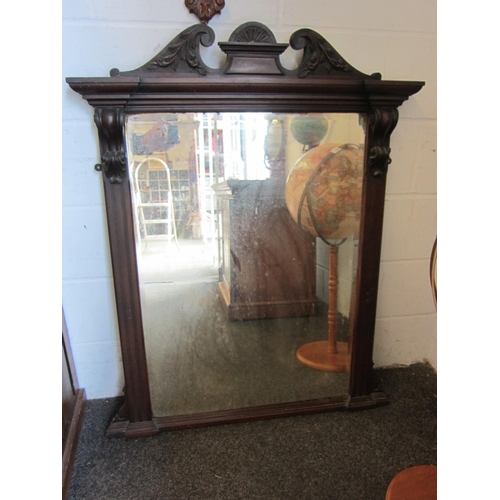 1008 - An Edwardian mahogany overmantel mirror with broken arch swan neck pediment, reeded column frame, be... 