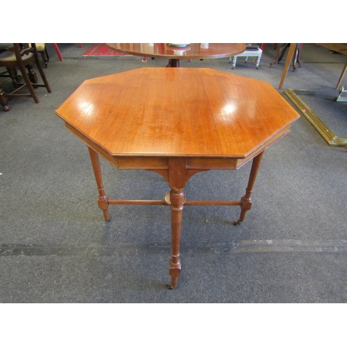 1095 - An Edwardian walnut two tier lamp table on castors, 81cm high x 81cm wide     (R) £15