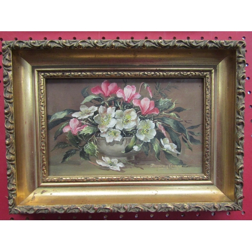 1111 - DOROTHY GARRETT (local artist): A pair of still life oils on board of flowers, both signed and ornat... 