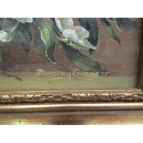 1111 - DOROTHY GARRETT (local artist): A pair of still life oils on board of flowers, both signed and ornat... 