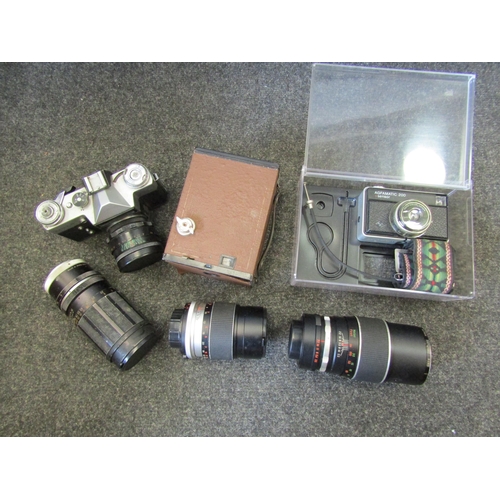 1149 - A box containing a quantity of cameras including lens, cased Zenit-E camera