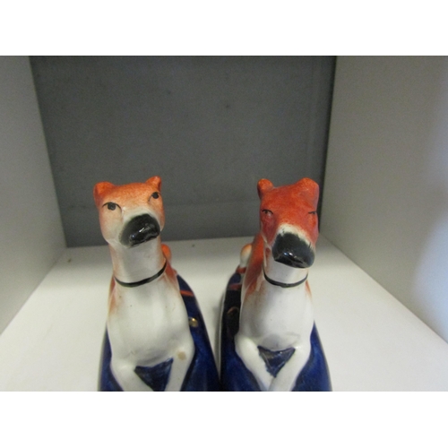 1246 - A pair of Staffordshire seated hunting hounds, 14cm height