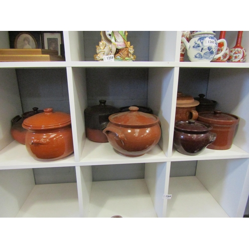 1262 - A collection of stoneware glazed casserole pots with lids (9)