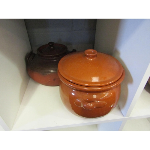 1262 - A collection of stoneware glazed casserole pots with lids (9)