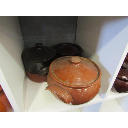 1262 - A collection of stoneware glazed casserole pots with lids (9)