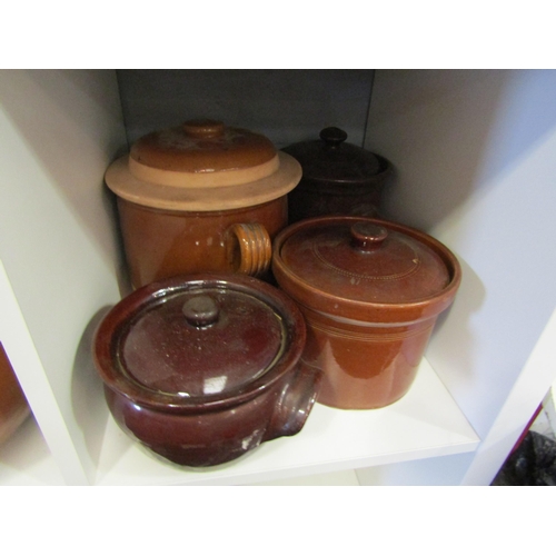 1262 - A collection of stoneware glazed casserole pots with lids (9)