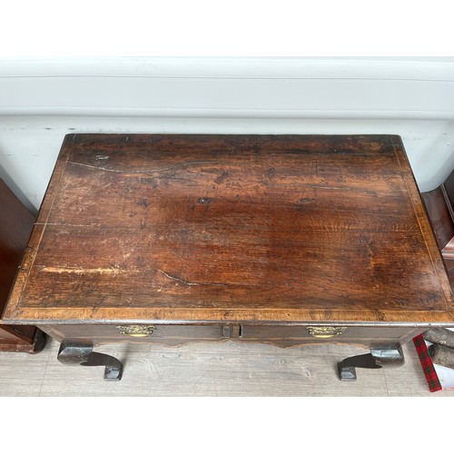 9011 - A Georgian oak lowboy with two drawers on cabriole legs to pad feet, 75cm x 96cm x 55cm