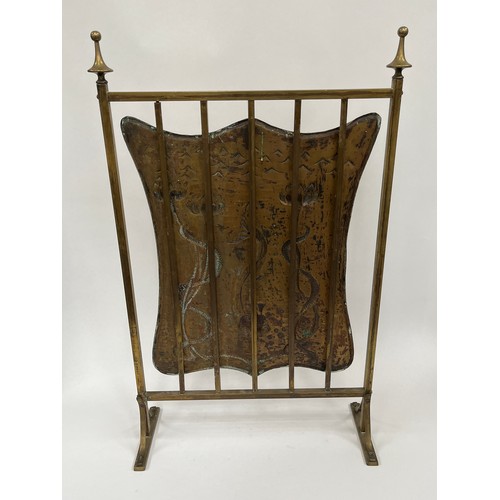 9047A - An Edwardian Art Nouveau brass fire screen with fish and floral detail