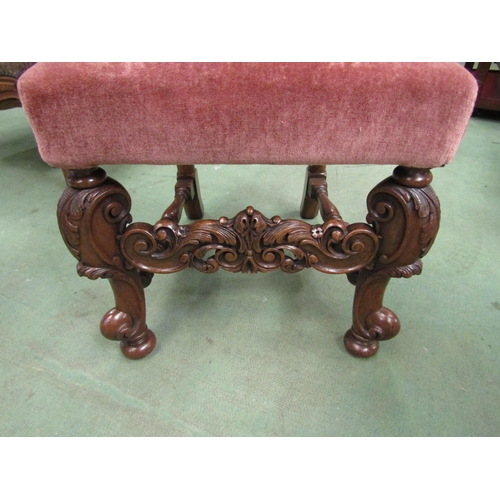 4002 - A George II revival carved walnut chair the camel hump back rest over acanthus leaf scroll carved fo... 