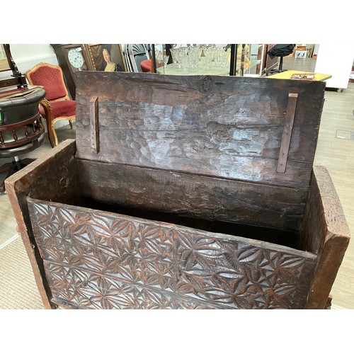 9022A - An Eastern carved wood chest, foliate front panel, lift plank lid, 87cm x 132cm x 48cm  (R)  £150